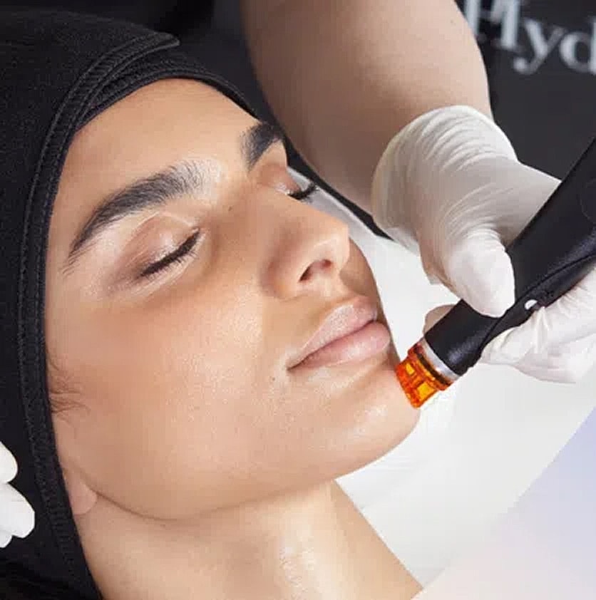 Woman receiving facial treatment with a spatula.