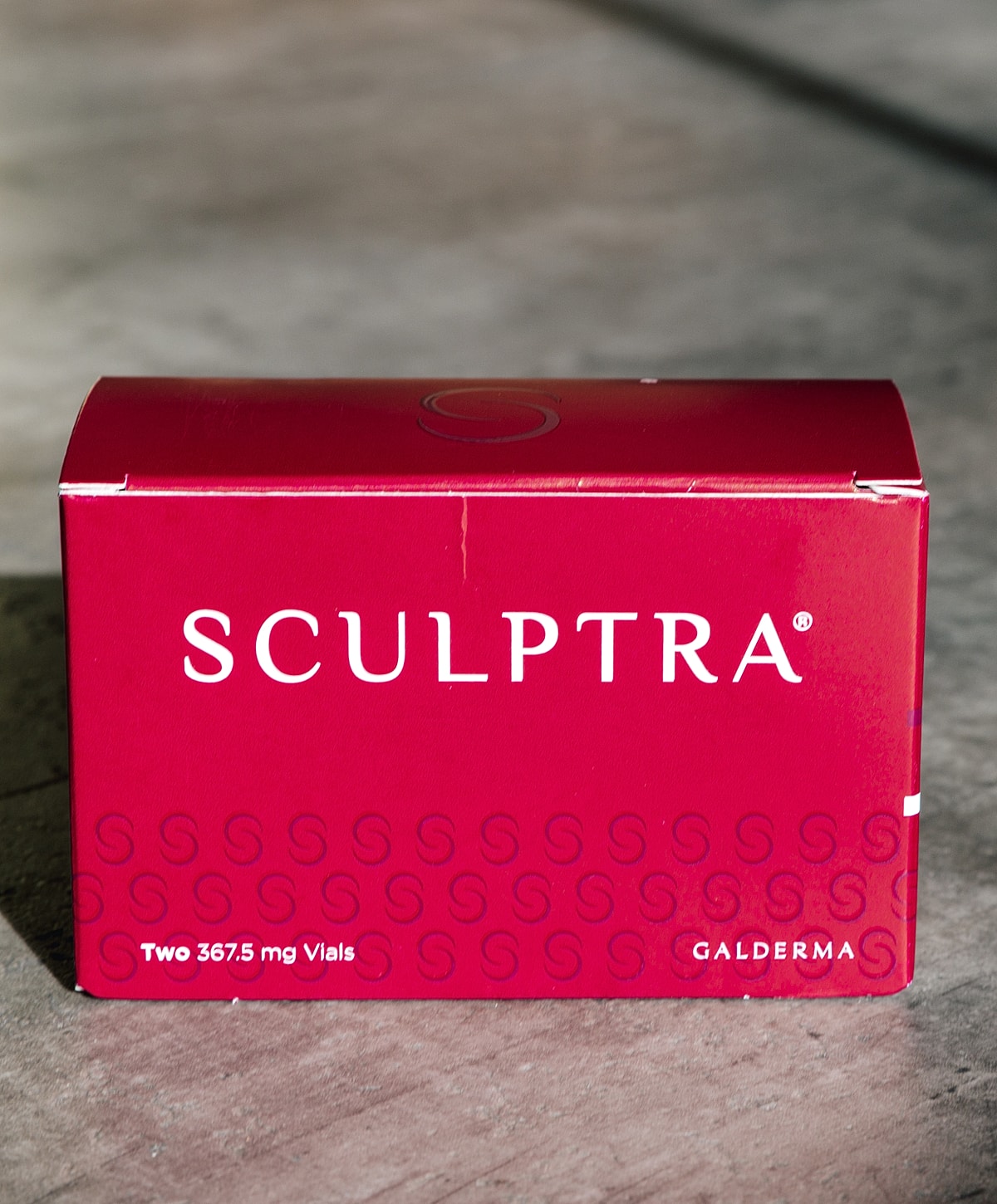 Sculptra product box with two vials displayed.