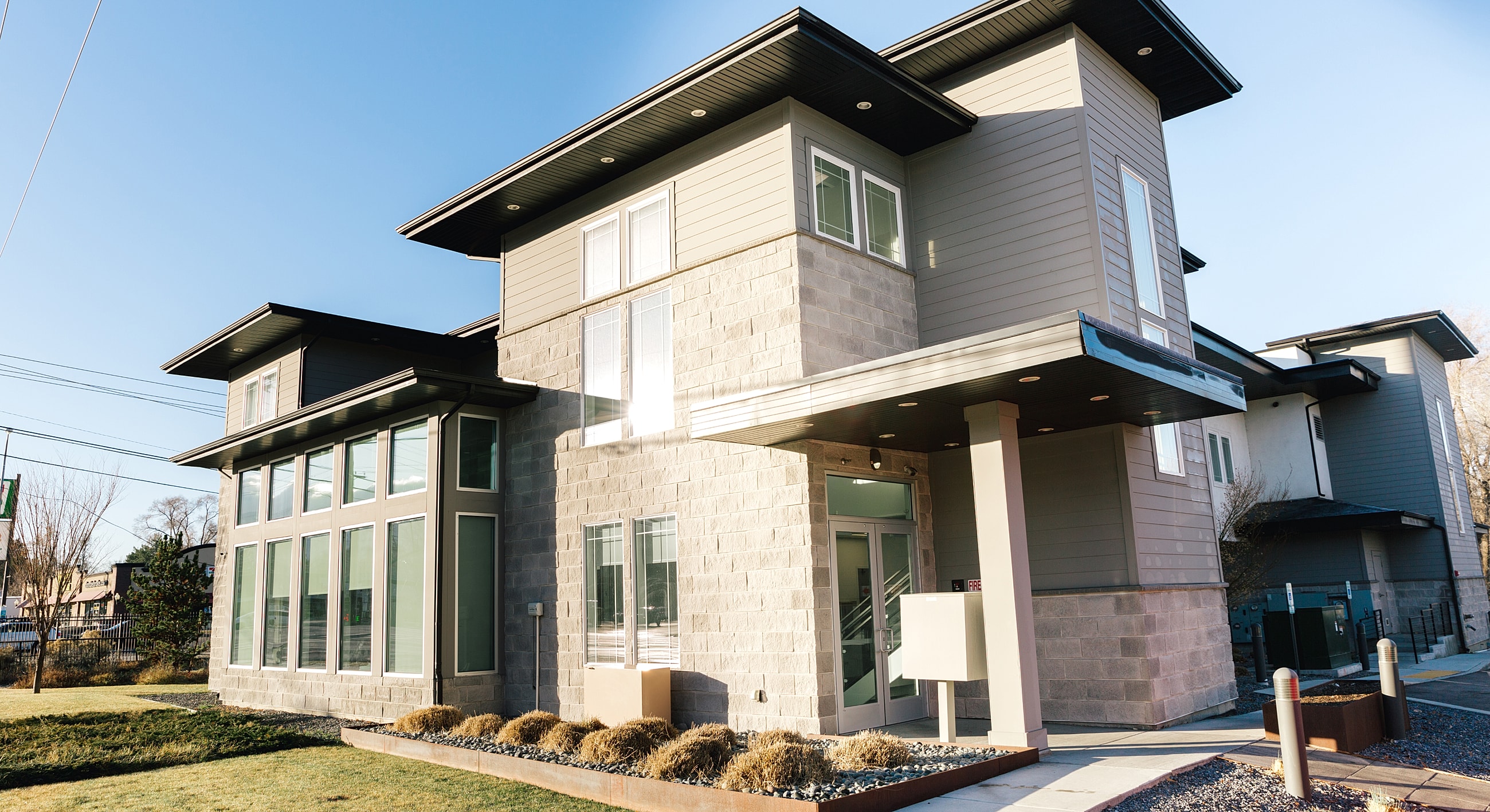 Modern building exterior with large windows.