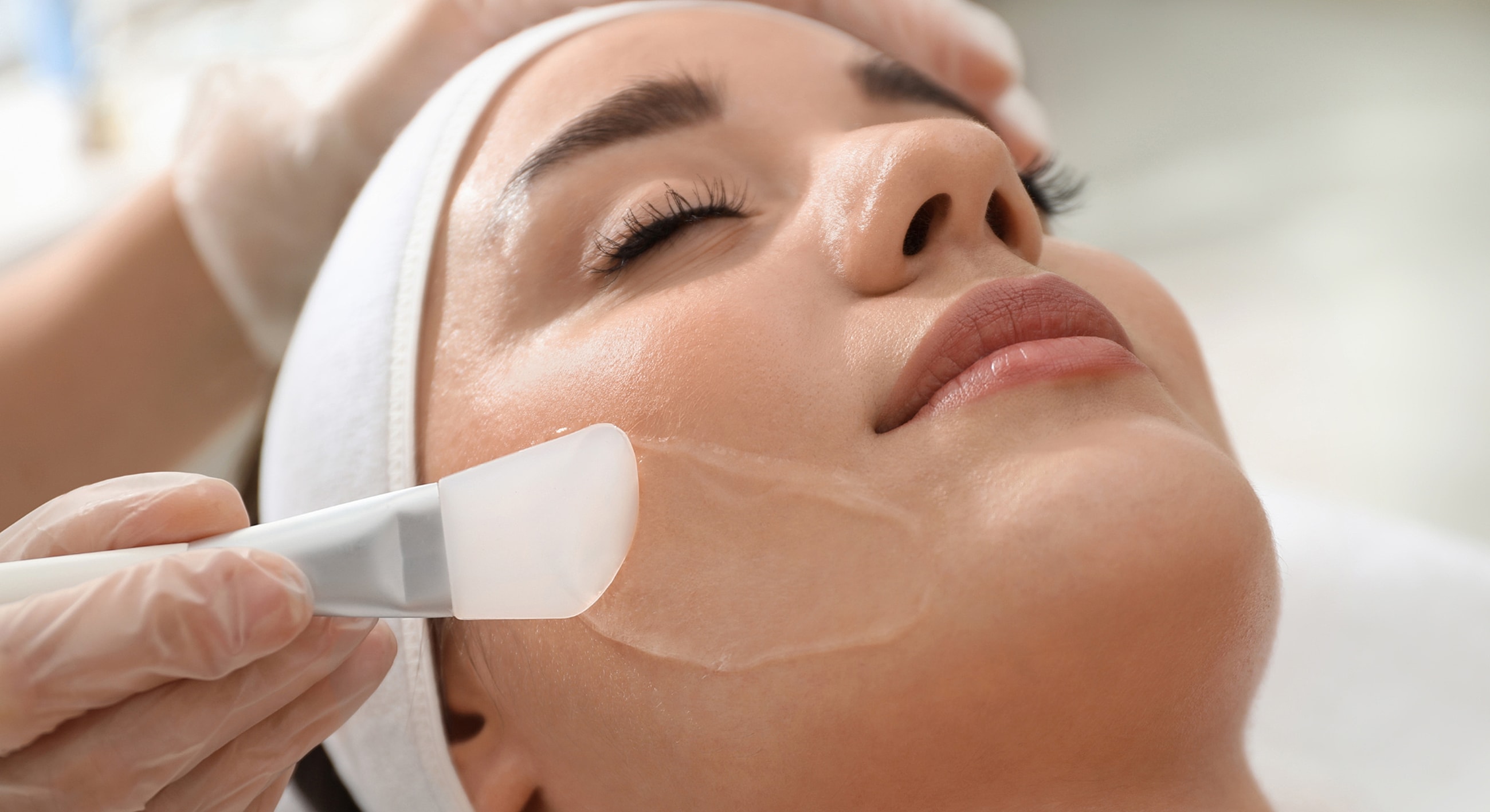 Facial treatment with a gentle peel application.