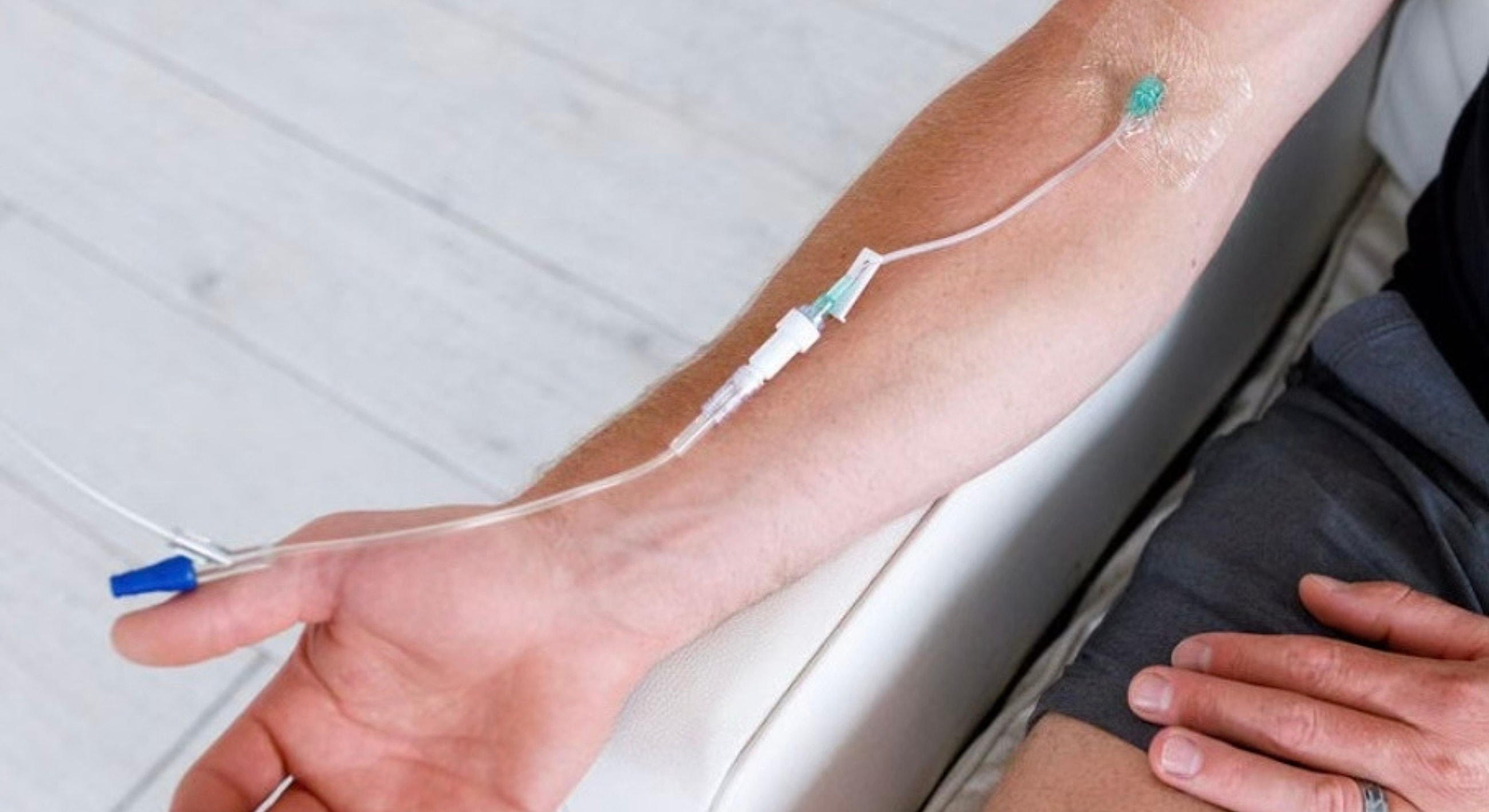 IV drip attached to a person's arm.